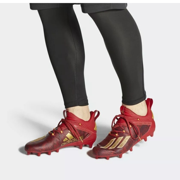 red and gold adidas football cleats